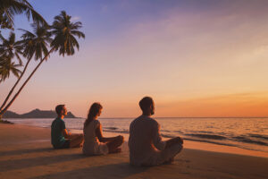 people doing a beach meditation